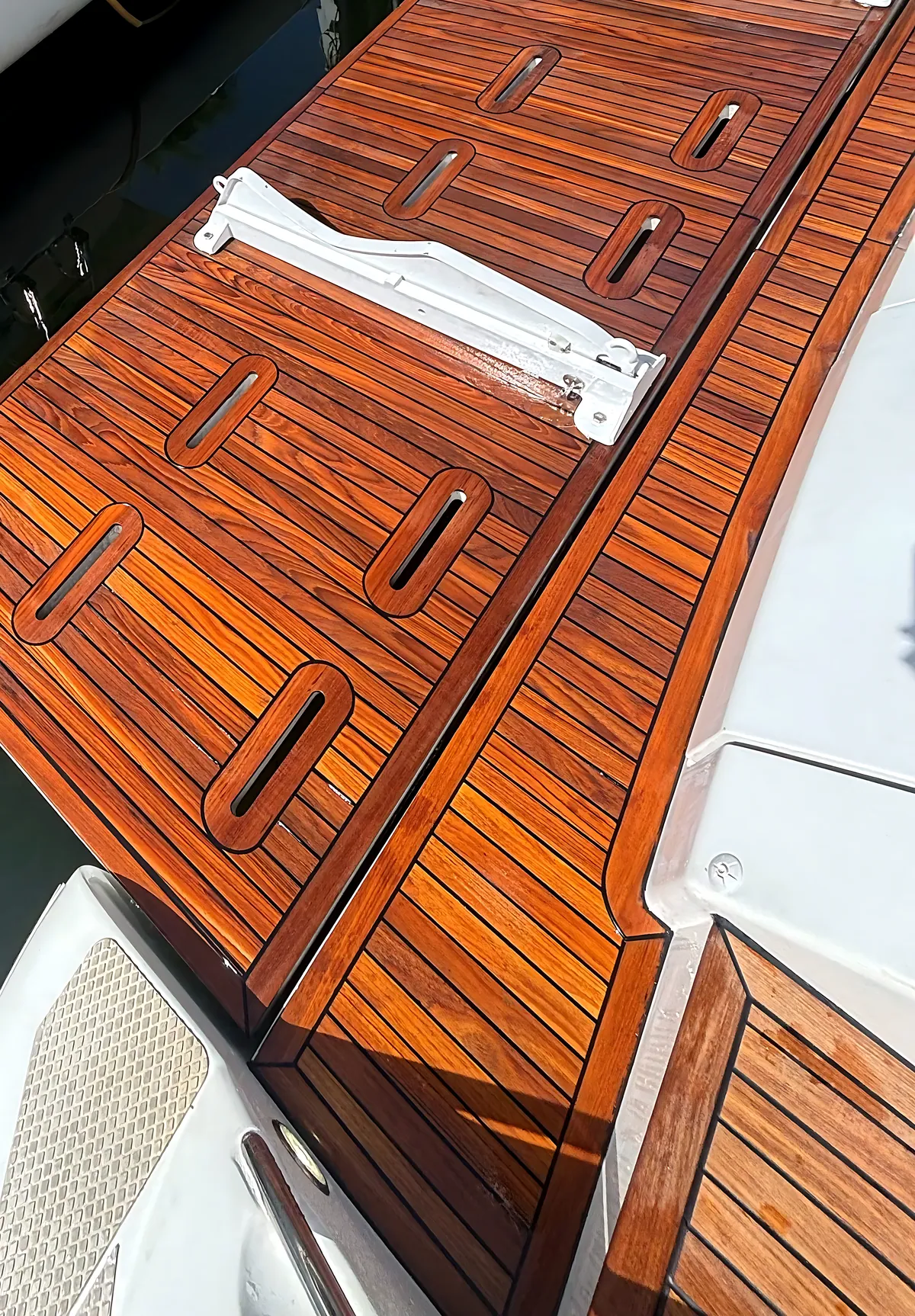 New teak swim platform installed on a motor yacht